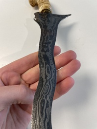 A collection of six krises with carved handles, four with scabbard, Indonesia, 19th C.