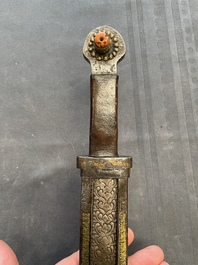 A varied collection of four decorated daggers, two inset with red coral and turquoise, Sri Lanka and Georgia, 18/19th C.