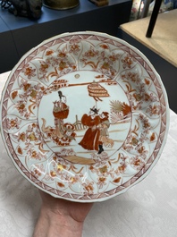 A pair of Chinese iron-red saucers and two plates, Kangxi/Yongzheng