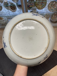 Six Chinese blue and white 'floral' bowls, a pair of dishes, a saucer and an iron-red-decorated plate, Qianlong