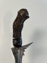 A collection of six krises with carved handles, four with scabbard, Indonesia, 19th C.