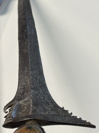 A collection of six krises with carved handles, four with scabbard, Indonesia, 19th C.