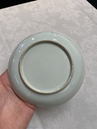 A pair of Chinese iron-red saucers and two plates, Kangxi/Yongzheng