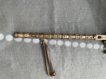 A gold lame woman's belt, a breast ornament and a silver karwat, Caucasus and Afghanistan, 19th C.