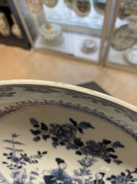 Six Chinese blue and white 'floral' bowls, a pair of dishes, a saucer and an iron-red-decorated plate, Qianlong