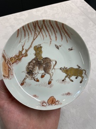 A pair of Chinese iron-red saucers and two plates, Kangxi/Yongzheng