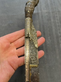 A varied collection of four decorated daggers, two inset with red coral and turquoise, Sri Lanka and Georgia, 18/19th C.