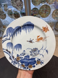 Six Chinese blue and white 'floral' bowls, a pair of dishes, a saucer and an iron-red-decorated plate, Qianlong