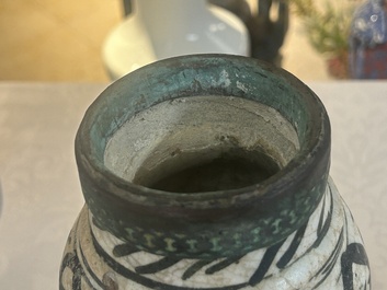 An early Islamic pottery albarello with engraved copper mount and cover, probably Nishapur, Iran, 10/11th C.