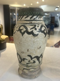 An early Islamic pottery albarello with engraved copper mount and cover, probably Nishapur, Iran, 10/11th C.