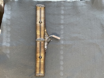 A gold lame woman's belt, a breast ornament and a silver karwat, Caucasus and Afghanistan, 19th C.