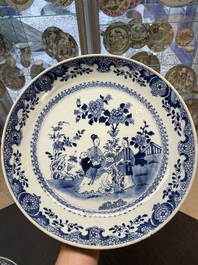 Six Chinese blue and white 'floral' bowls, a pair of dishes, a saucer and an iron-red-decorated plate, Qianlong