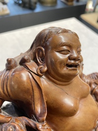 Two Chinese boxwood sculptures of Luohan and Liuhai and a bamboo sculpture of a sage, 17/19th C.