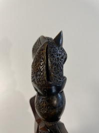 A collection of six krises with carved handles, four with scabbard, Indonesia, 19th C.