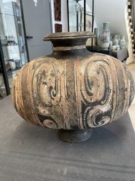 Two Chinese terracotta sculptures and a painted cocoon vase, Han