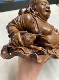 Two Chinese boxwood sculptures of Luohan and Liuhai and a bamboo sculpture of a sage, 17/19th C.