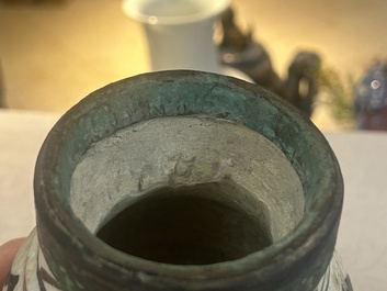 An early Islamic pottery albarello with engraved copper mount and cover, probably Nishapur, Iran, 10/11th C.