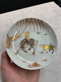 A pair of Chinese iron-red saucers and two plates, Kangxi/Yongzheng