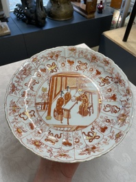 A pair of Chinese iron-red saucers and two plates, Kangxi/Yongzheng