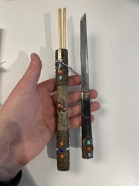A varied collection of Chinese and Japanese eating set trousses, a Tibetan 'kapala' and two daggers, 18/19th C.
