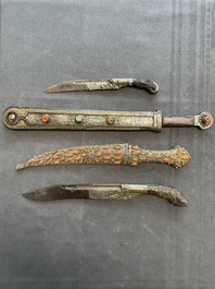 A varied collection of four decorated daggers, two inset with red coral and turquoise, Sri Lanka and Georgia, 18/19th C.