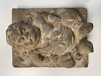 A Chinese architectural pottery tile of a 'non-Han' figure, Song/Jin