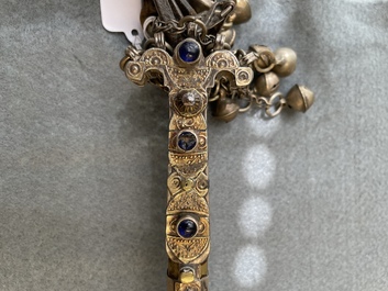 A gold lame woman's belt, a breast ornament and a silver karwat, Caucasus and Afghanistan, 19th C.