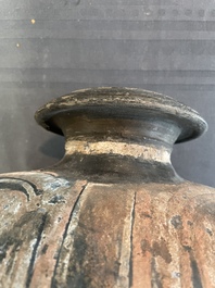 Two Chinese terracotta sculptures and a painted cocoon vase, Han