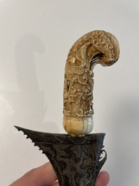 A collection of six krises with carved handles, four with scabbard, Indonesia, 19th C.