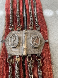 A gold lame woman's belt, a breast ornament and a silver karwat, Caucasus and Afghanistan, 19th C.