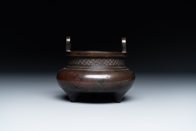 A Chinese bronze two-handled tripod censer, Ding 鼎 mark, Yuan/Ming