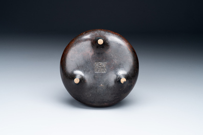 A Chinese bronze two-handled tripod censer, Ding 鼎 mark, Yuan/Ming