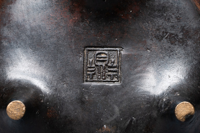 A Chinese bronze two-handled tripod censer, Ding 鼎 mark, Yuan/Ming