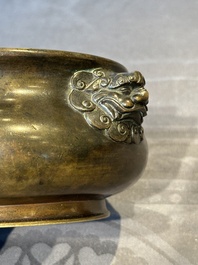 A Chinese bronze censer with lion-form handles, Xuande mark, 17/18th C.