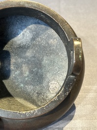 A Chinese bronze two-handled tripod censer, Ding 鼎 mark, Yuan/Ming