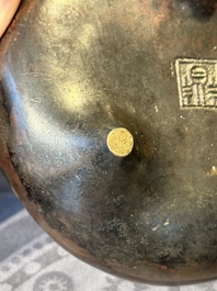 A Chinese bronze two-handled tripod censer, Ding 鼎 mark, Yuan/Ming
