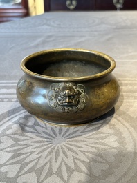 A Chinese bronze censer with lion-form handles, Xuande mark, 17/18th C.