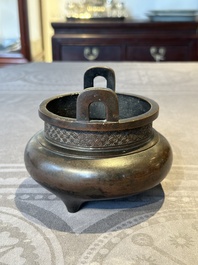 A Chinese bronze two-handled tripod censer, Ding 鼎 mark, Yuan/Ming