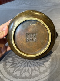 A Chinese bronze censer with lion-form handles, Xuande mark, 17/18th C.