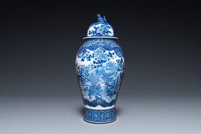 A massive Japanese blue and white Arita vase and cover with an eagle, a shishi and cub, 19th C.