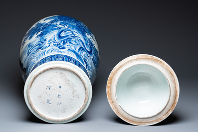 A massive Japanese blue and white Arita vase and cover with an eagle, a shishi and cub, 19th C.
