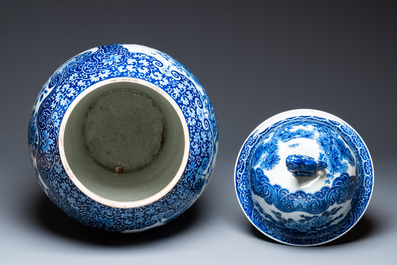 A massive Japanese blue and white Arita vase and cover with an eagle, a shishi and cub, 19th C.