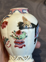 A pair of Chinese famille rose 'antiquities' tea caddies and covers, Yongzheng/Qianlong