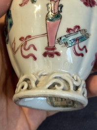 A pair of Chinese famille rose 'antiquities' tea caddies and covers, Yongzheng/Qianlong