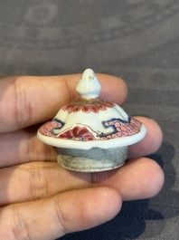 A pair of Chinese famille rose 'antiquities' tea caddies and covers, Yongzheng/Qianlong