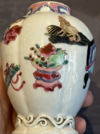 A pair of Chinese famille rose 'antiquities' tea caddies and covers, Yongzheng/Qianlong