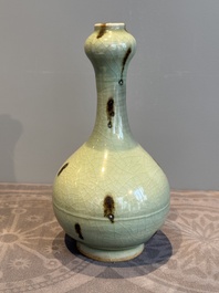 A Chinese russet-splashed Longquan celadon garlic-mouth vase, Yuan/Ming