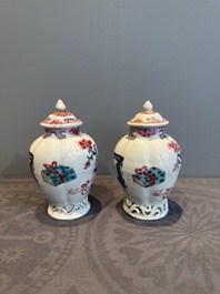 A pair of Chinese famille rose 'antiquities' tea caddies and covers, Yongzheng/Qianlong