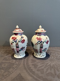 A pair of Chinese famille rose 'antiquities' tea caddies and covers, Yongzheng/Qianlong