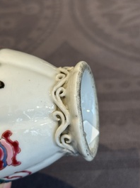A pair of Chinese famille rose 'antiquities' tea caddies and covers, Yongzheng/Qianlong
